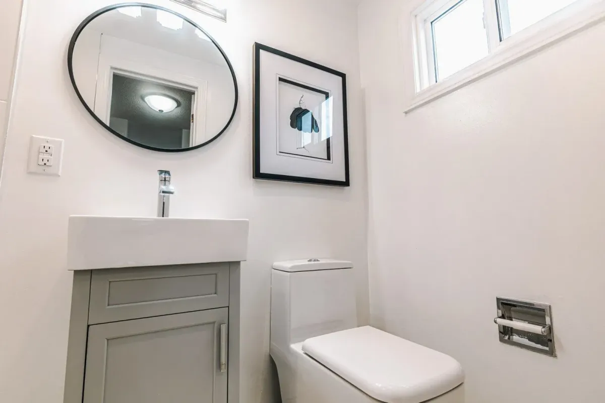 Renovated 3-piece primary ensuite at 110 Holliday Dr with a modern vanity and glass walk-in shower.