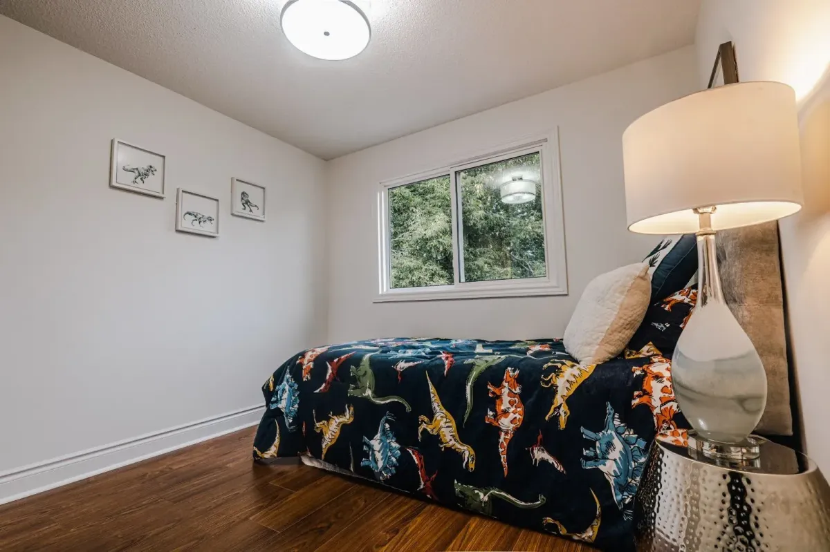 Close-up of the fourth bedroom at 110 Holliday Dr highlighting the hardwood flooring and natural light.
