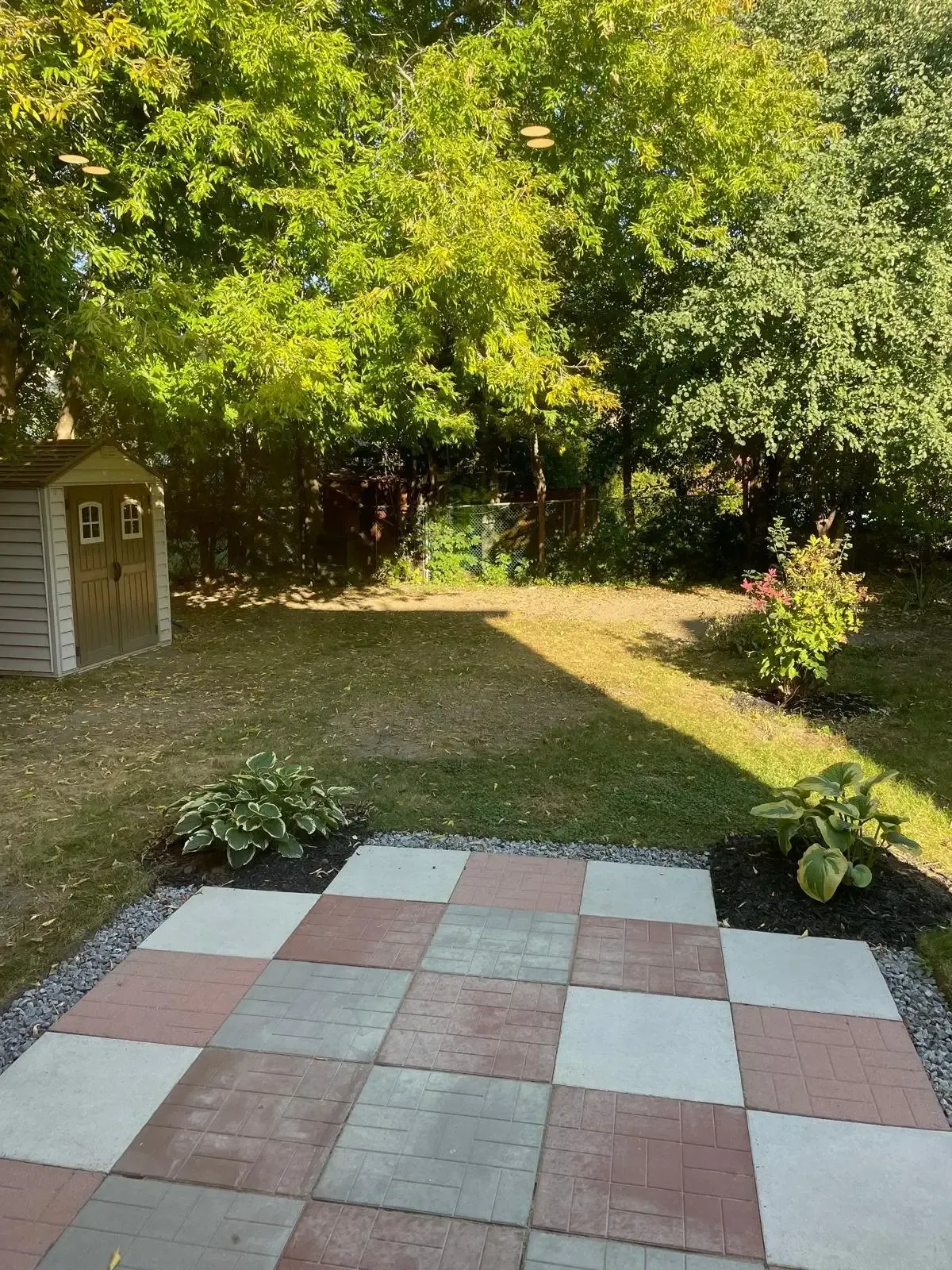 Close-up of the patterned stone patio at 110 Holliday Dr, ideal for outdoor furniture.