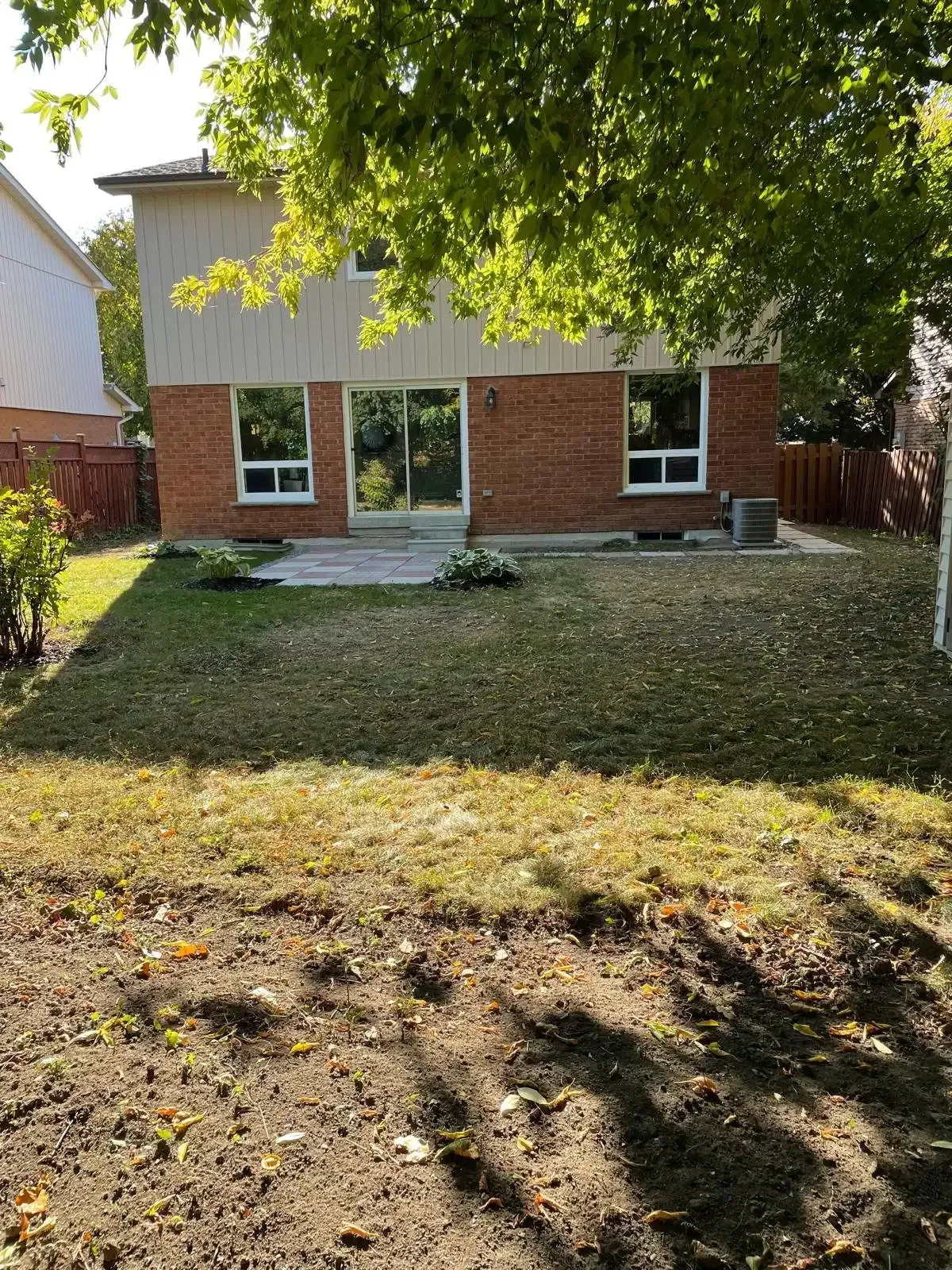 Wide view of the 50 x 121 ft lot at 110 Holliday Dr showing the expansive lawn.