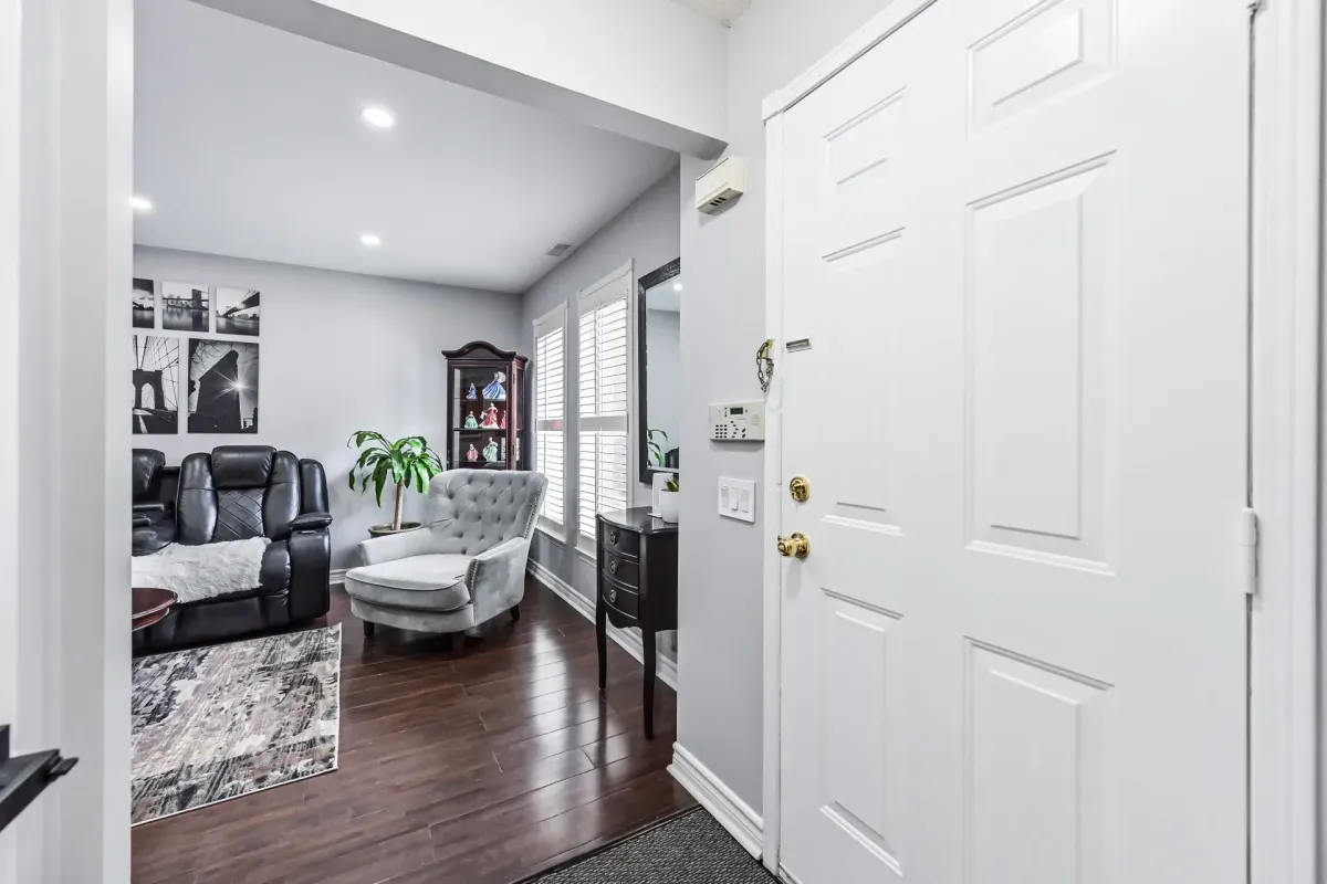 Bright foyer and white front door entrance of 900 Steeles Ave W #112, Lakeview Estates.