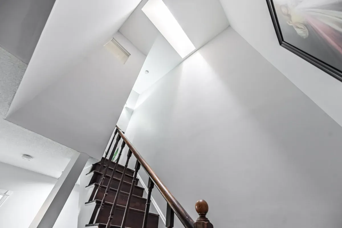 Interior vaulted ceiling and skylight detail at 900 Steeles Ave W #112, Vaughan.