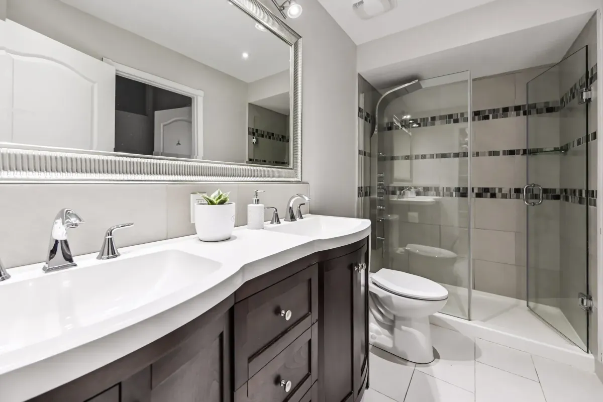 Luxury ensuite bathroom with a large glass-walled shower at 900 Steeles Ave W #112.