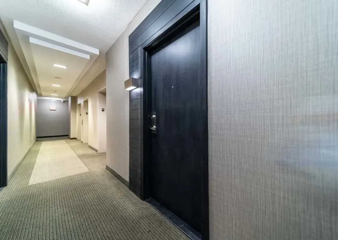 Modern building hallway and suite entrance for 235 Sherway Gardens Rd #401, showcasing clean, contemporary design.