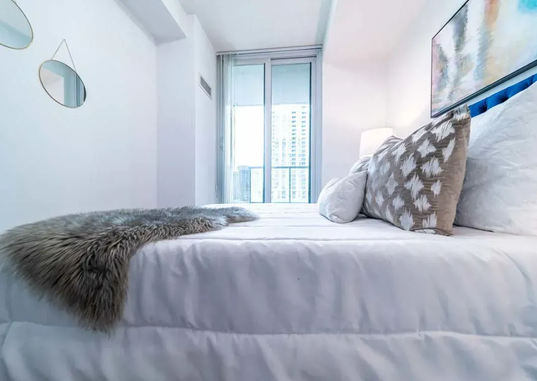 Low-angle view of the comfortable primary bedroom suite at 235 Sherway Gardens Rd #401.