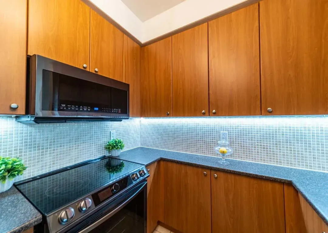 Detailed view of the custom cabinetry and sleek countertops in the kitchen of 235 Sherway Gardens Rd #401.
