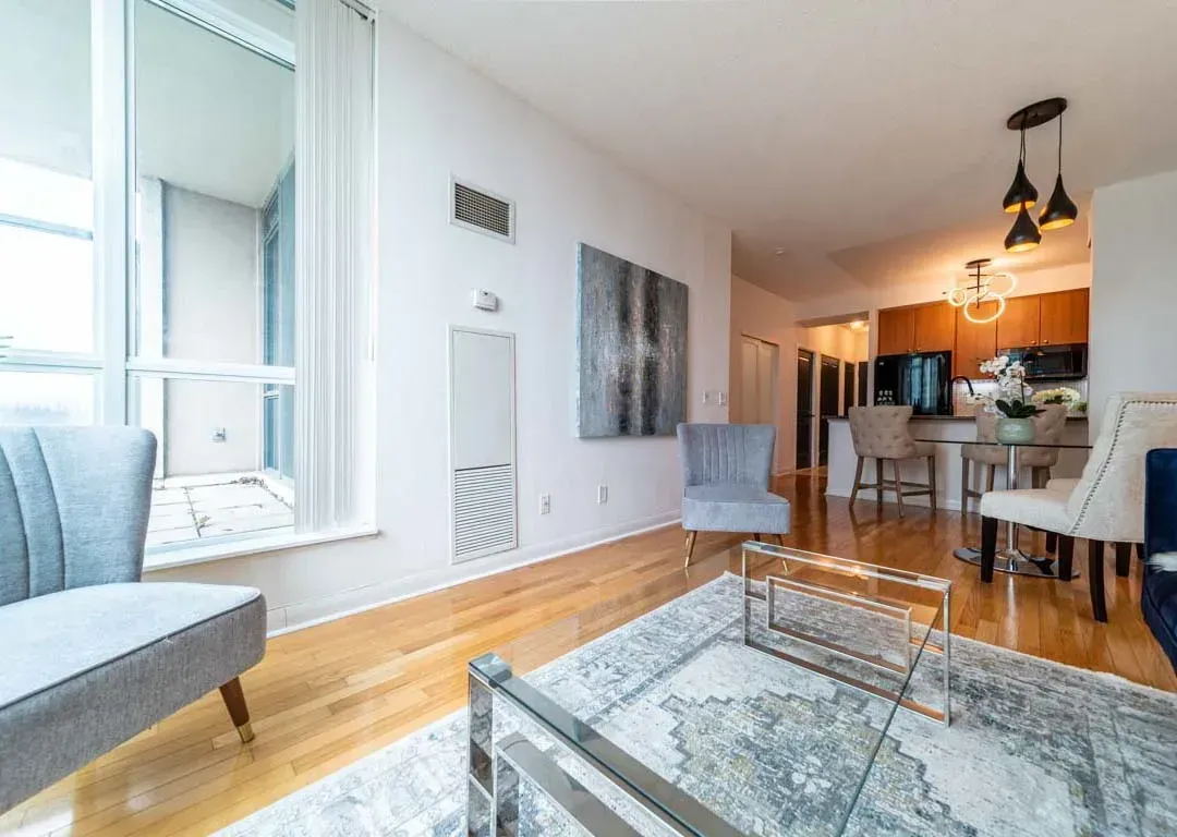 Versatile living room layout at 235 Sherway Gardens Rd #401 with premium hardwood flooring and designer lighting.