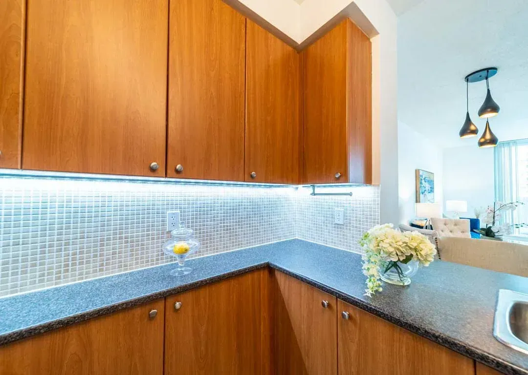 Designer kitchen corner at 235 Sherway Gardens Rd #401 showcasing a mosaic tile backsplash.