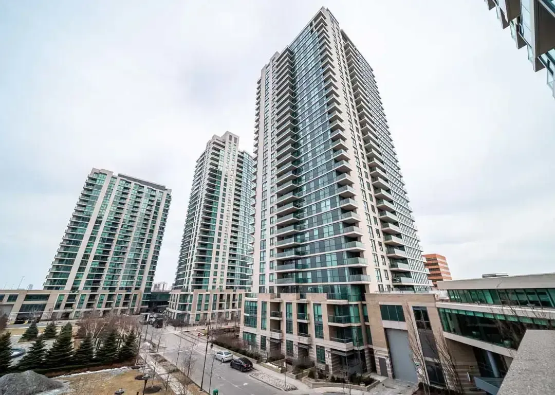 Exterior shot of the One Sherway high-rise towers at 235 Sherway Gardens Rd against a cloudy sky.
