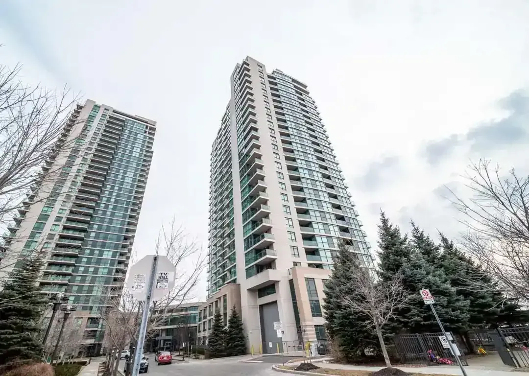 Vertical view of the modern glass architecture of 235 Sherway Gardens Rd.