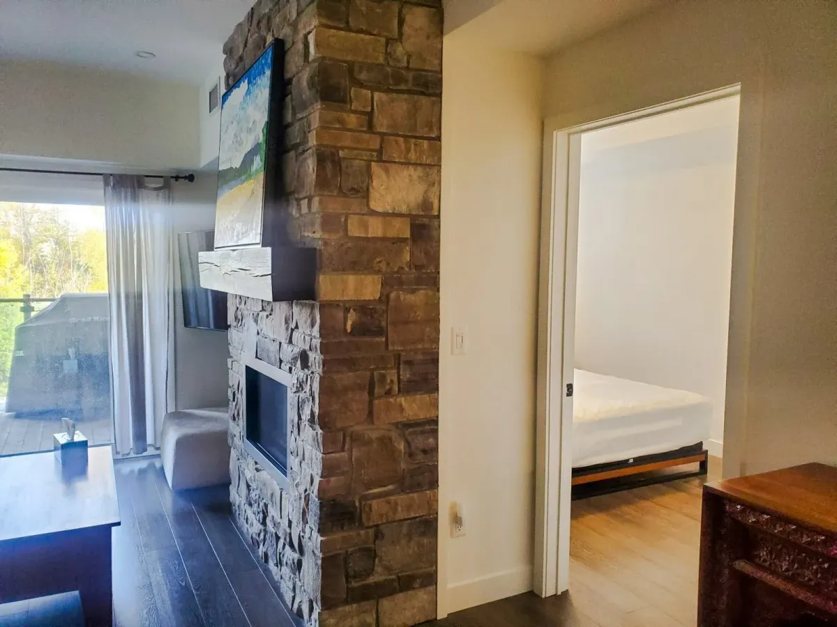 Hallway at 11 Beausoleil #105 showing the transition from the living area to the bedrooms and bathrooms.