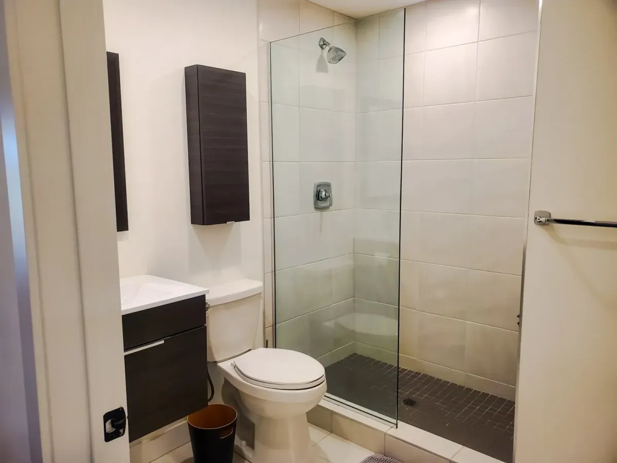 Modern 3-piece bathroom at 11 Beausoleil #105 featuring a glass-enclosed walk-in shower.