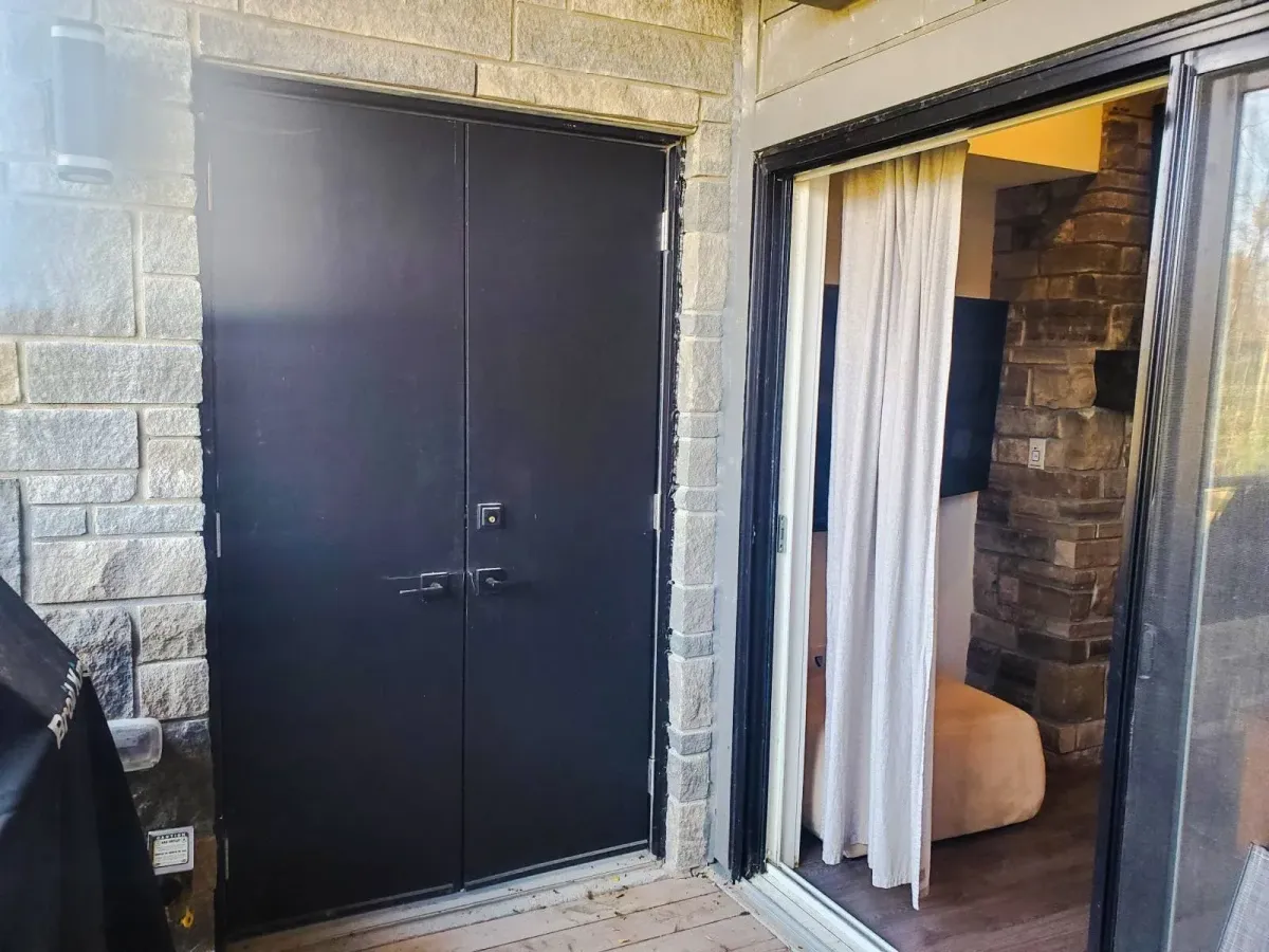 View from the private walk-out balcony at 11 Beausoleil #105 with a focus on the secure outdoor storage.