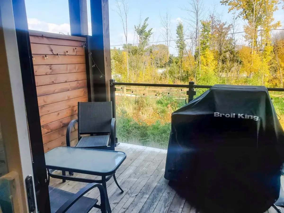 Scenic balcony view at 11 Beausoleil #105 overlooking the lush greenery of the Windfall Nature Preserve.