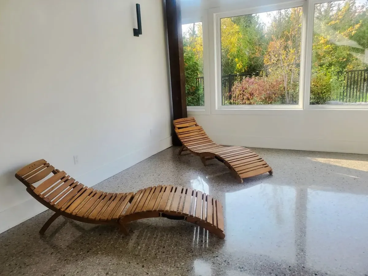 Nordic-inspired relaxation lounge with wooden chaises at the Zephyr Springs spa at 11 Beausoleil.