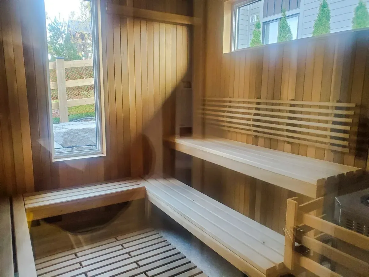 Professional-grade sauna room available to residents of 11 Beausoleil as part of the community amenities.