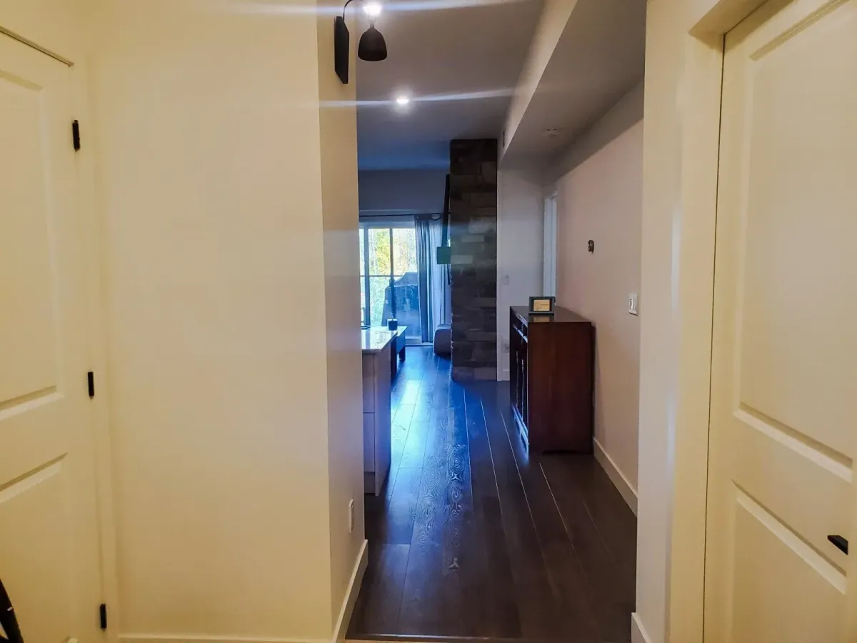 Entry hallway of 11 Beausoleil #105 leading into the bright, open-concept main floor.