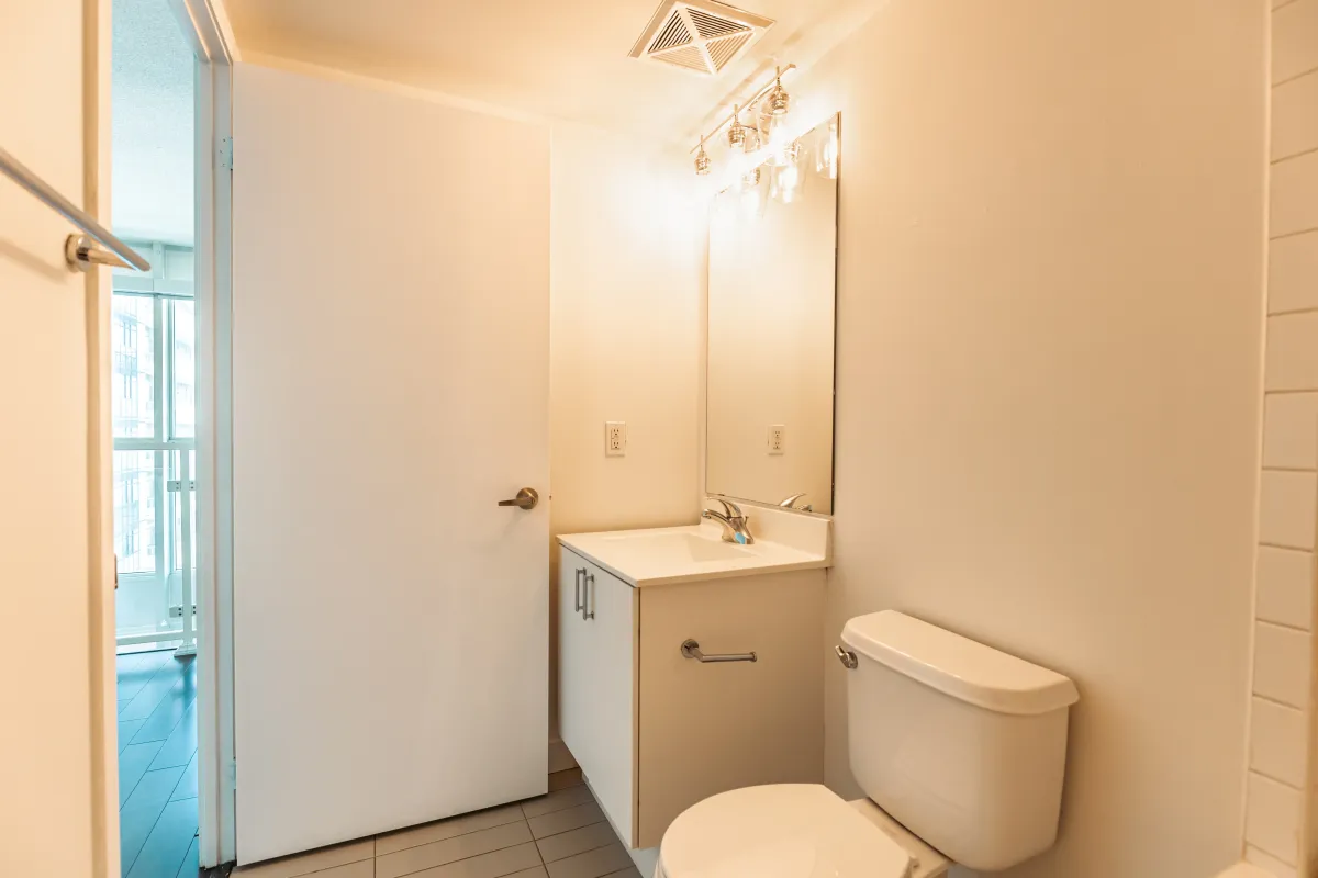 Main floor powder room at 155 Legion Rd N #2311 with contemporary fixtures and neutral décor.