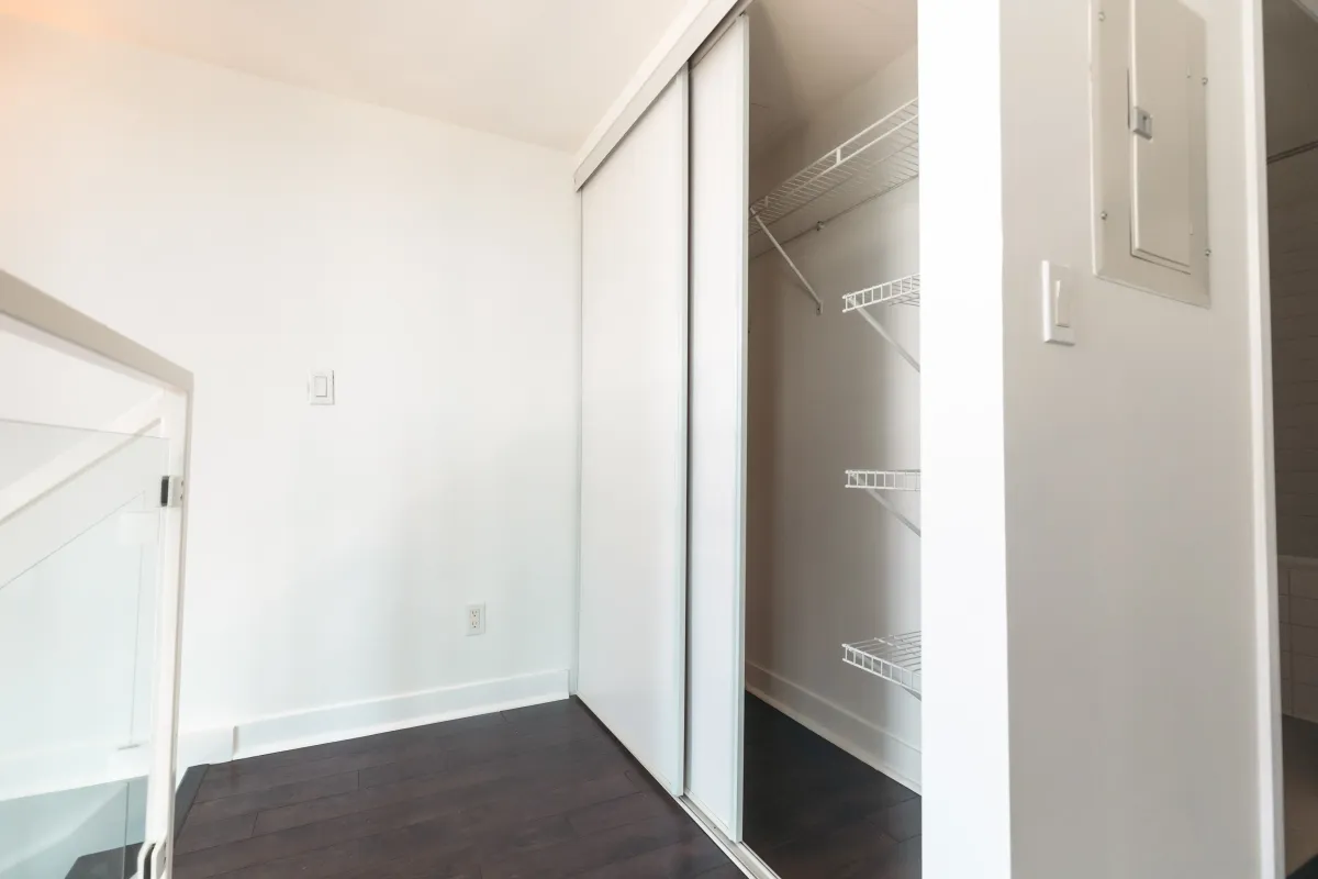 View of the spacious second-floor landing and closet area in the primary suite of 155 Legion Rd N #2311.