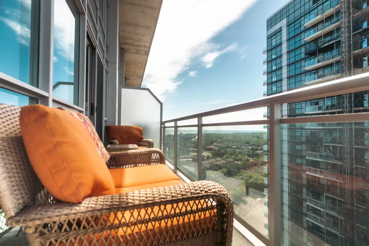 Sunset-facing balcony at 155 Legion Rd N #2311 with glass railings and unobstructed horizon views.