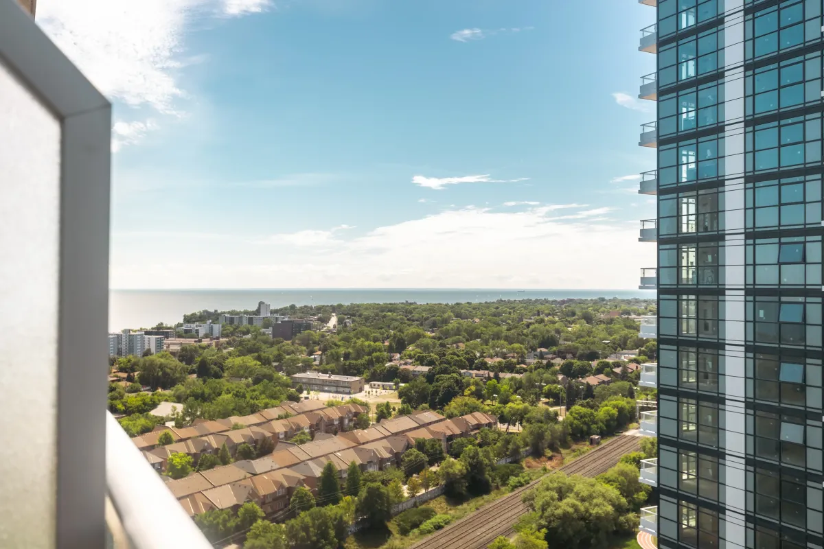 Panoramic city view from the 23rd floor of 155 Legion Rd N, overlooking Etobicoke and green spaces.