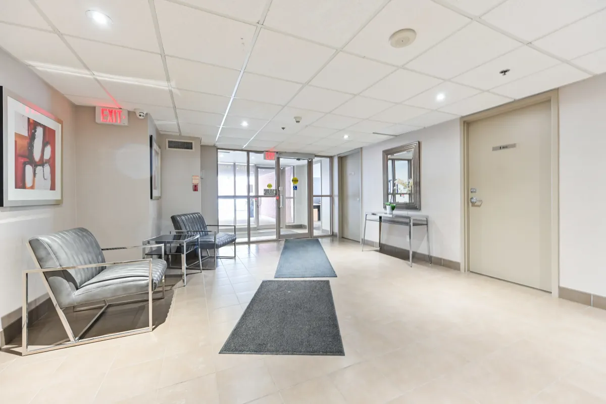 Bright and secure lobby entrance at 1369 Bloor St W, Suite 1416, featuring contemporary seating and clean, modern finishes.