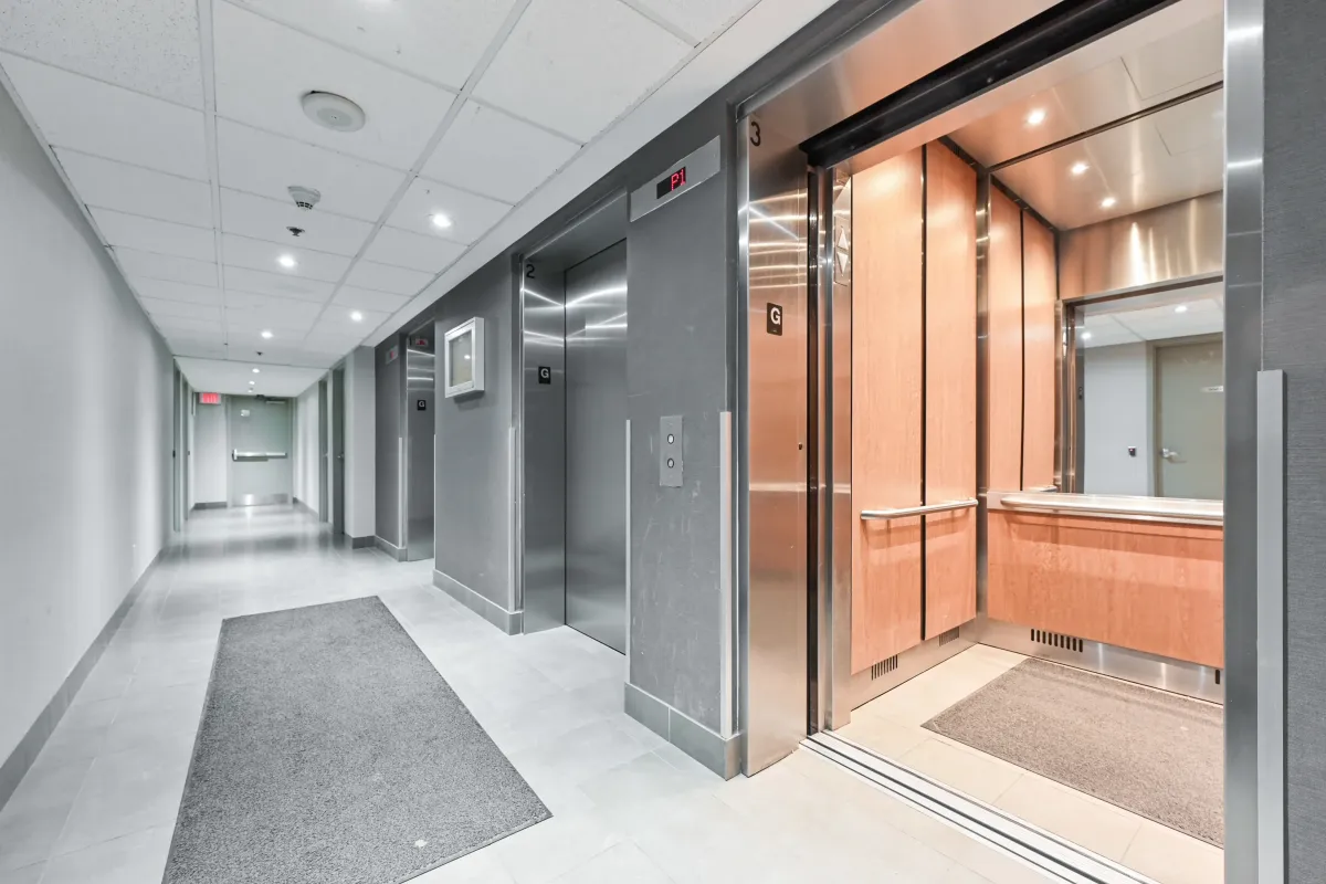 Well-lit elevator hallway at 1369 Bloor St W, Suite 1416, providing secure and easy access to the high-floor residence.