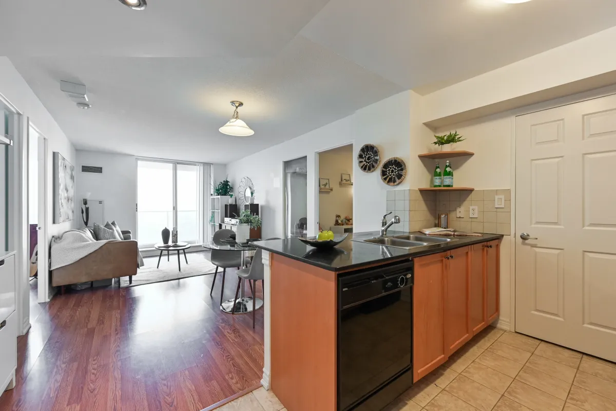Open-concept kitchen and dining area at 1369 Bloor St W, Suite 1416, highlighting the modern floor plan and natural light.