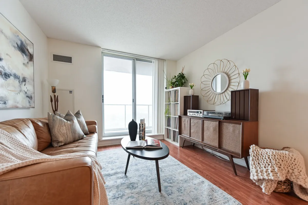 Stylishly decorated living space in Suite 1416 at 1369 Bloor St W, showcasing the split-bedroom floor plan for maximum privacy.