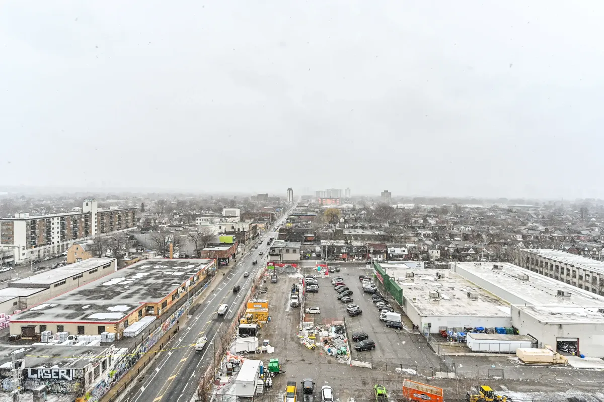 High-floor urban view from 1369 Bloor St W, Suite 1416, overlooking the vibrant Junction Triangle neighborhood.