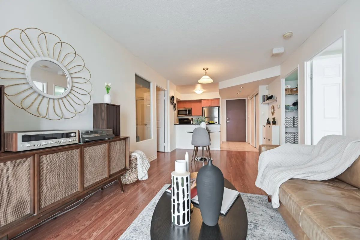 Seamless flow between the living and kitchen areas in the 2-bedroom residence at 1369 Bloor St W, Suite 1416.