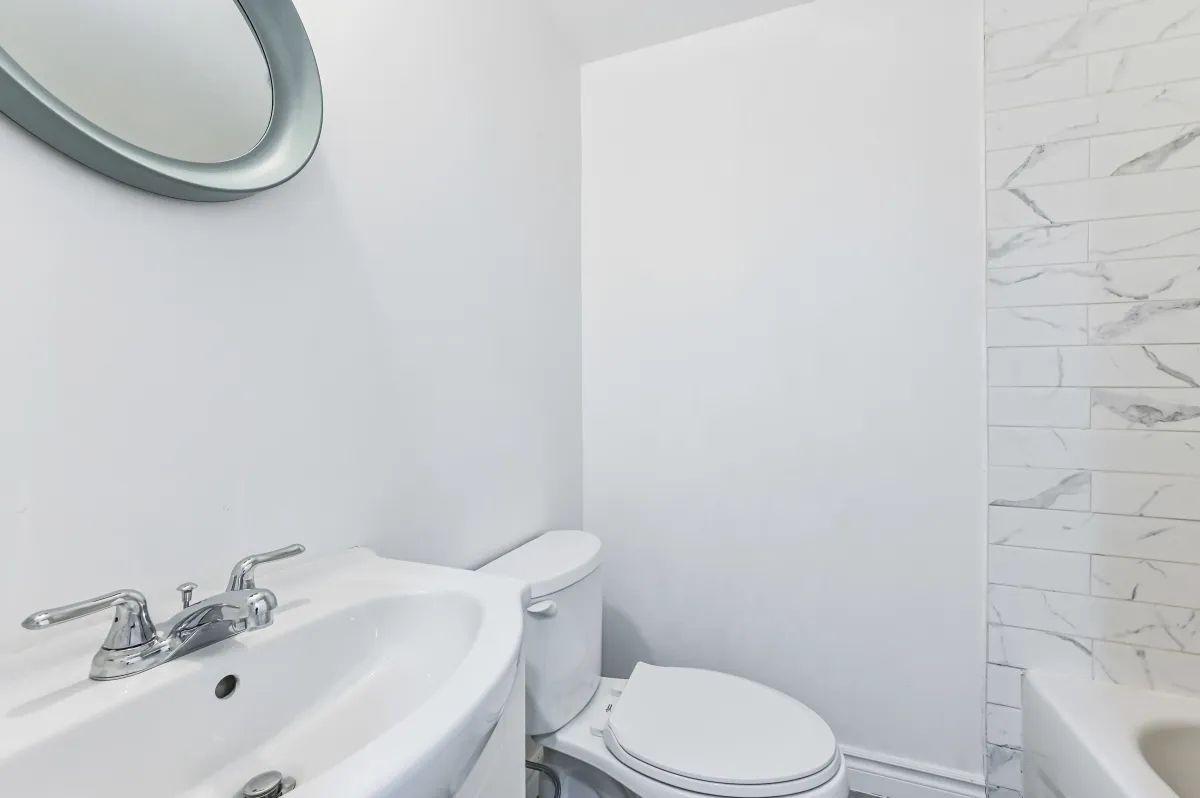 Clean 2-piece guest powder room located on the main floor of 133 Howard Crescent.