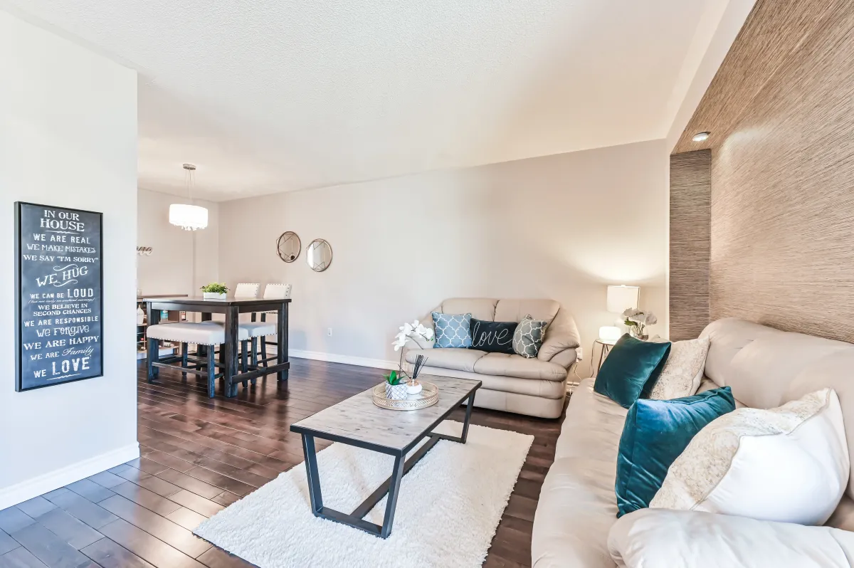 Spacious family room at 133 Howard Crescent with rich hardwood floors and an intuitive open-concept flow for entertaining.