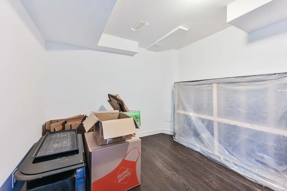 Flexible room in the finished basement of 133 Howard Crescent, ideal for a home office or private gym.