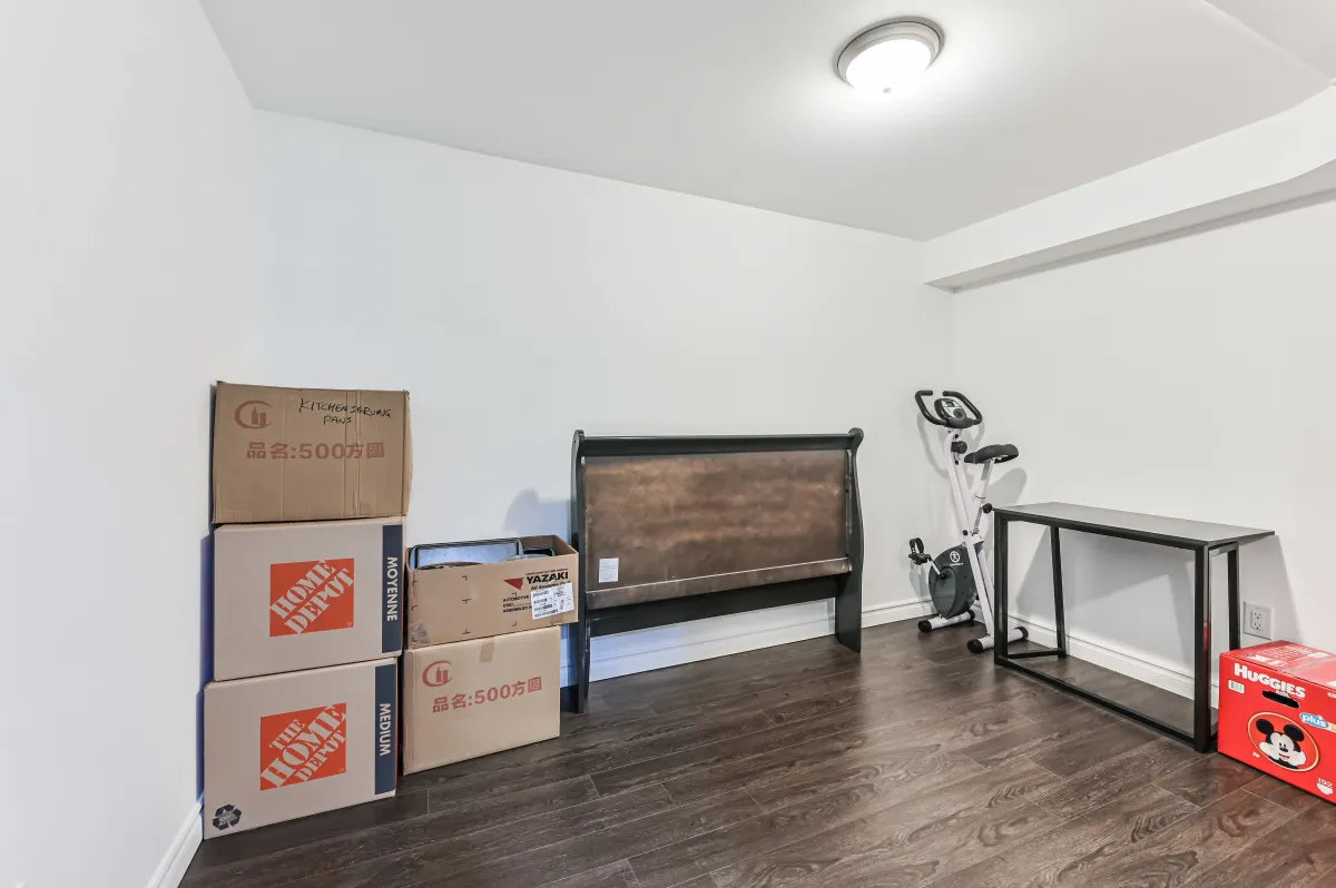 Secondary flexible basement room at 133 Howard Crescent, offering extra living space or a guest bedroom.