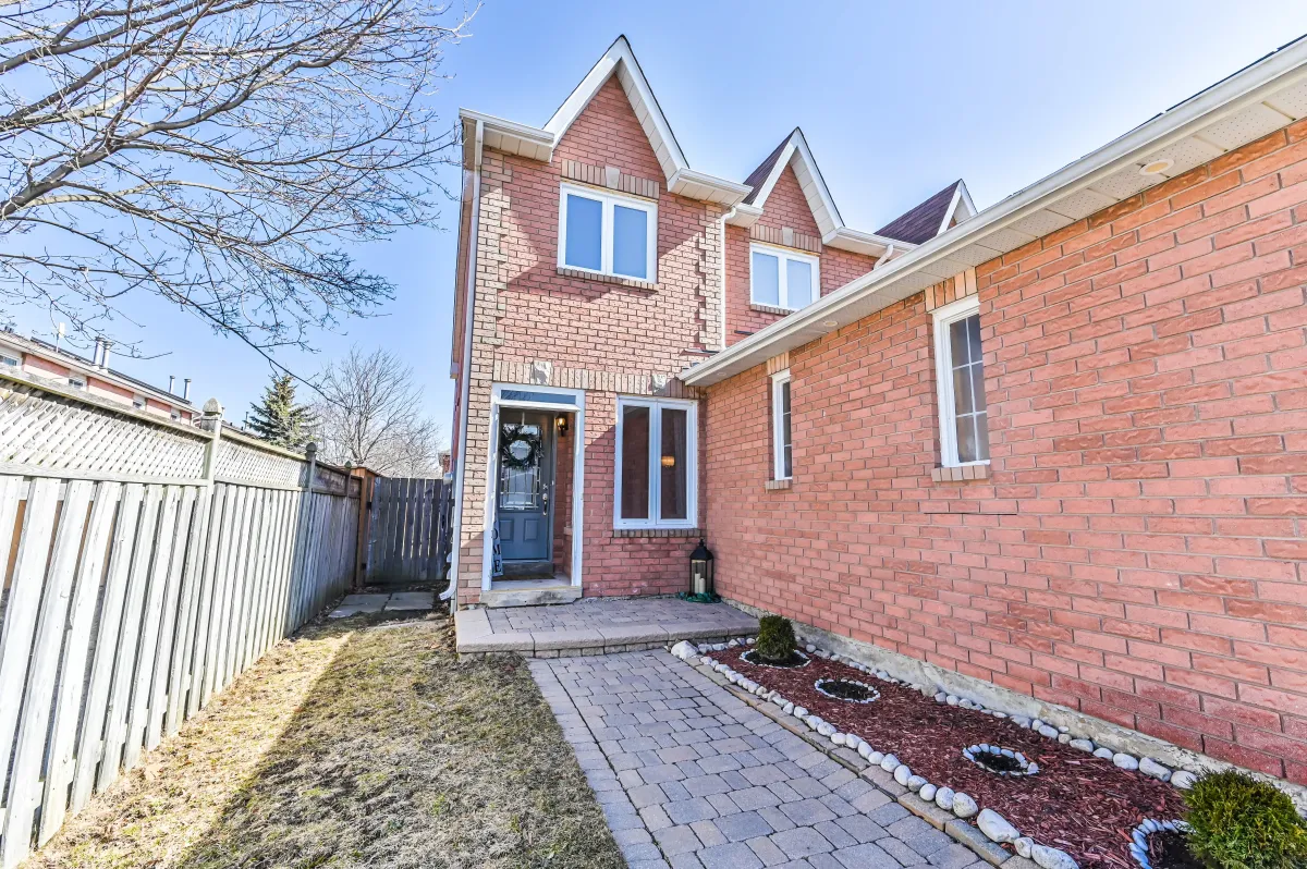 Front entrance and walkway of 133 Howard Crescent, located in an established Orangeville neighborhood near Highway 10.