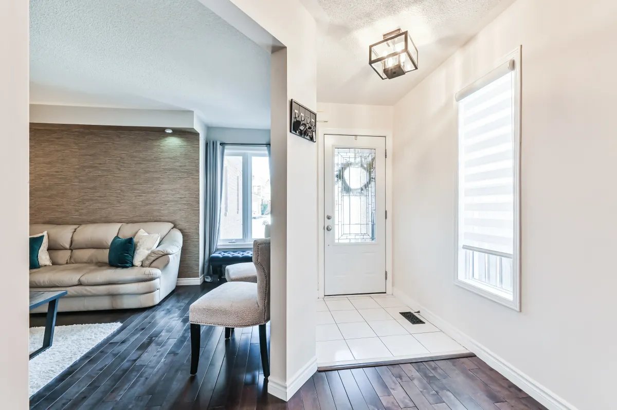 View from the foyer of 133 Howard Crescent, showcasing the bright interior and transition into the formal dining area.