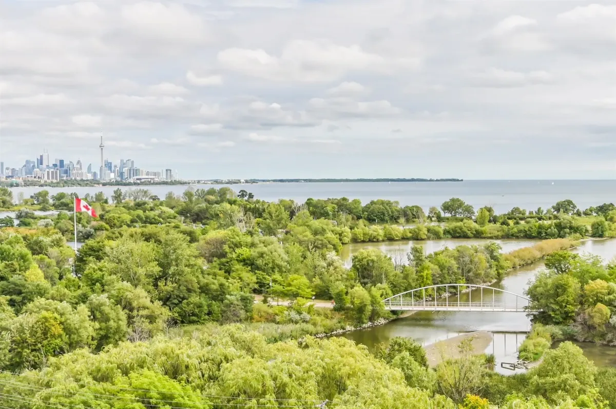 Lake, trees, park, city, CN tower view are all found on your private balcony