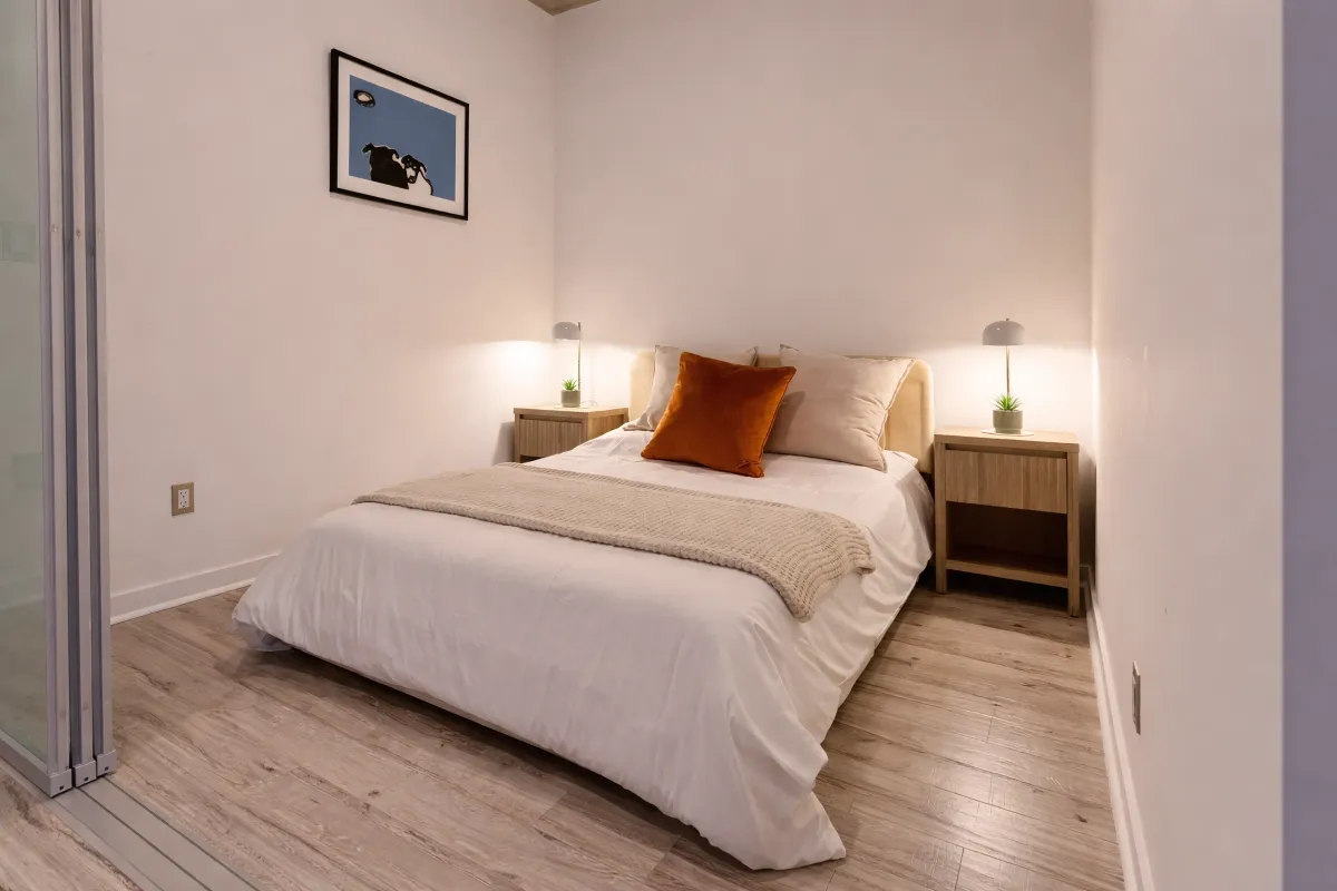 Den with sliding glass door at unit 305 at 23 Brant St