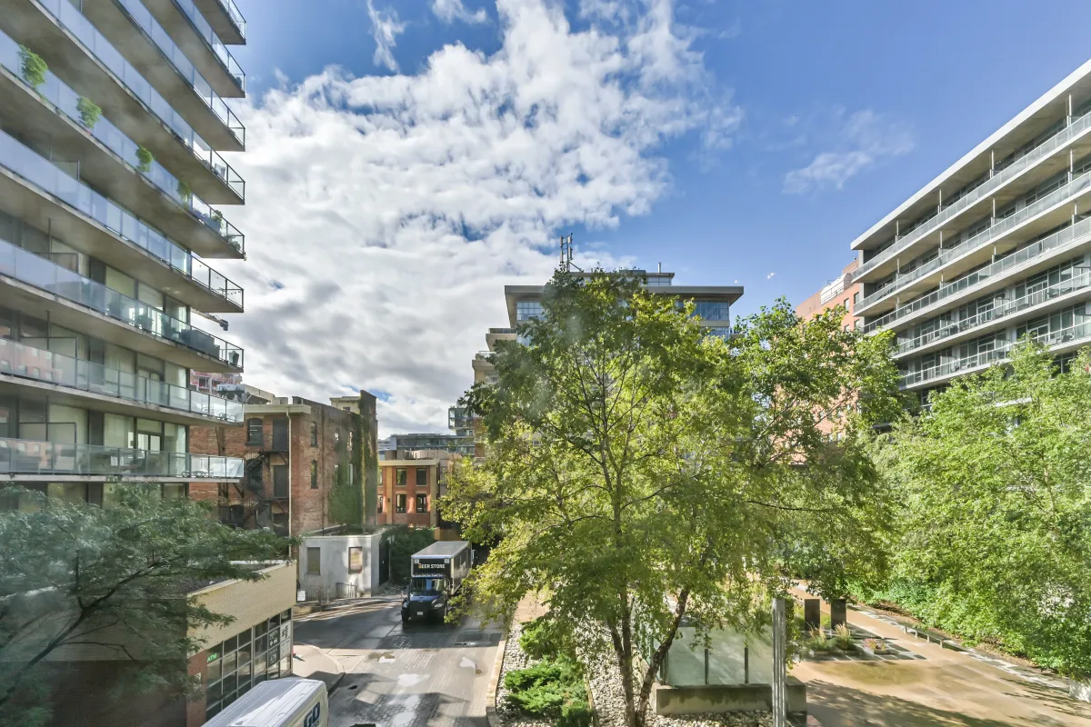Look out onto the tranquil parkette from your living room