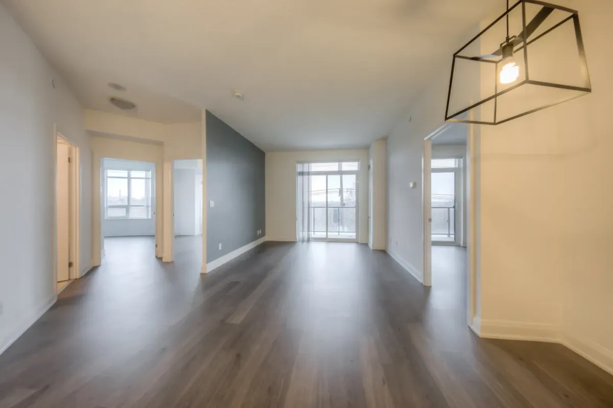 Open concept living room with walk-out to expanded balcony at 25 Fontenay Crt