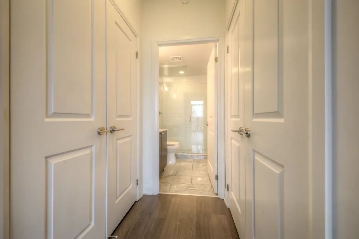 Modern, bright bathroom with large shower with glass door