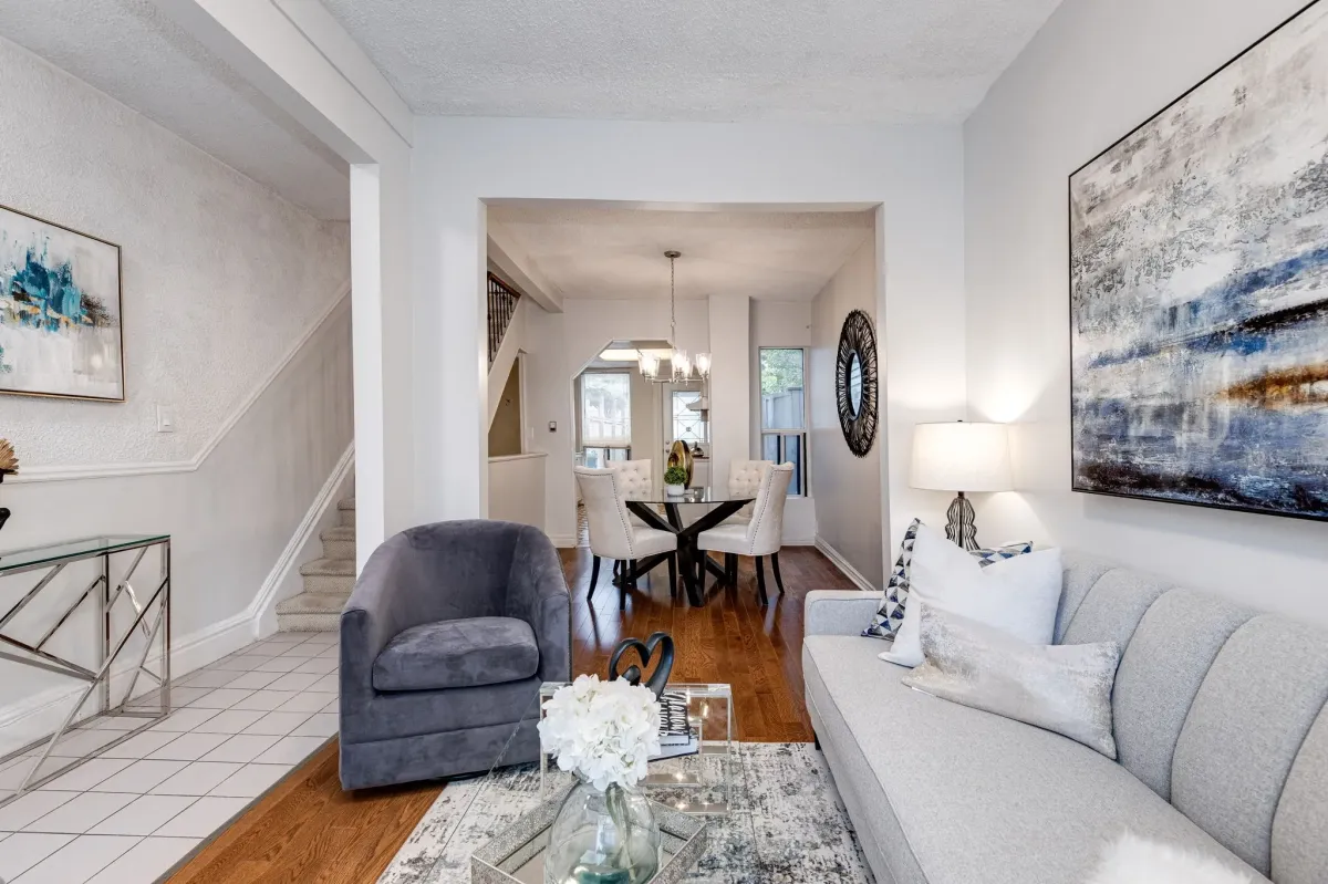 Open-concept living room into dining room and stairs to the side