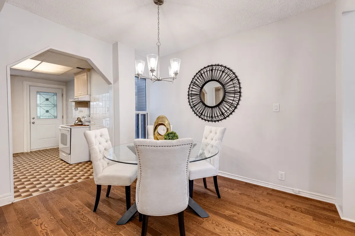 Large, open-concept dining room into dining room and stairs to the side
