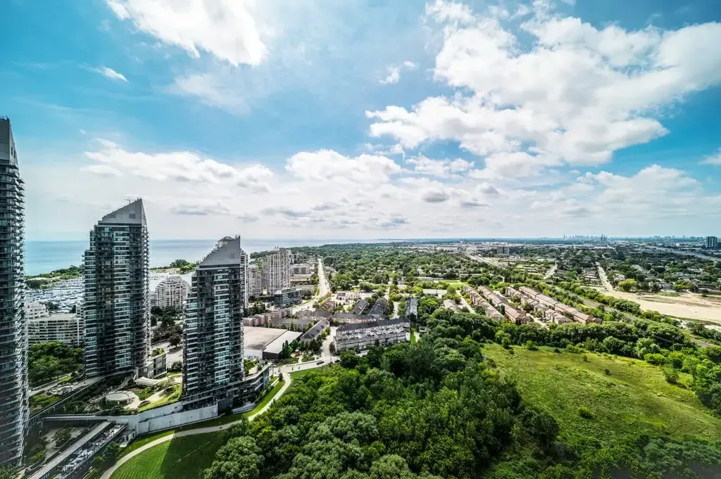 High-altitude view from 10 Park Lawn Rd, Unit 3402 showing the density of trees and nearby residential architecture.
