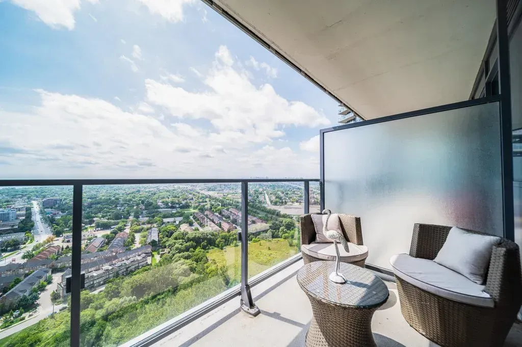 Wide-angle view from the balcony of 10 Park Lawn Rd, Unit 3402 showing the lush landscape and horizon.