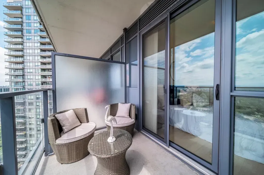Perspective shot of the 10 Park Lawn Rd, Unit 3402 balcony highlighting the modern architecture and height.