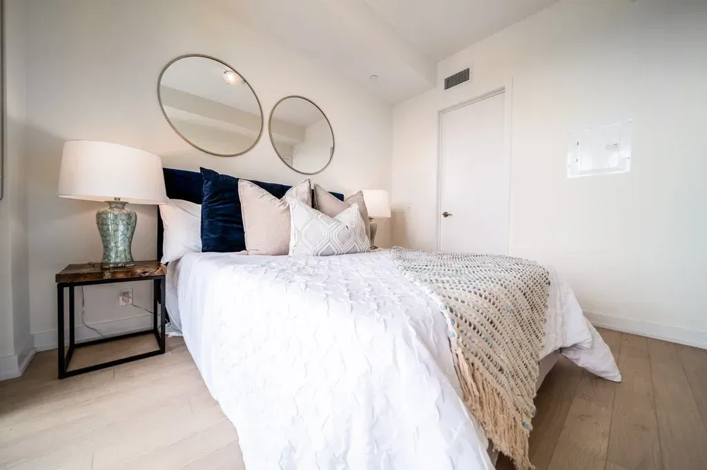 Close-up of the comfortable queen bed and stylish nightstands in 10 Park Lawn Rd, Unit 3402.