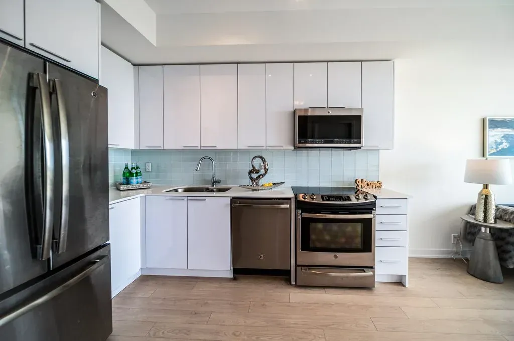 Modern stainless steel oven and white quartz countertops at 10 Park Lawn Rd, Unit 3402.