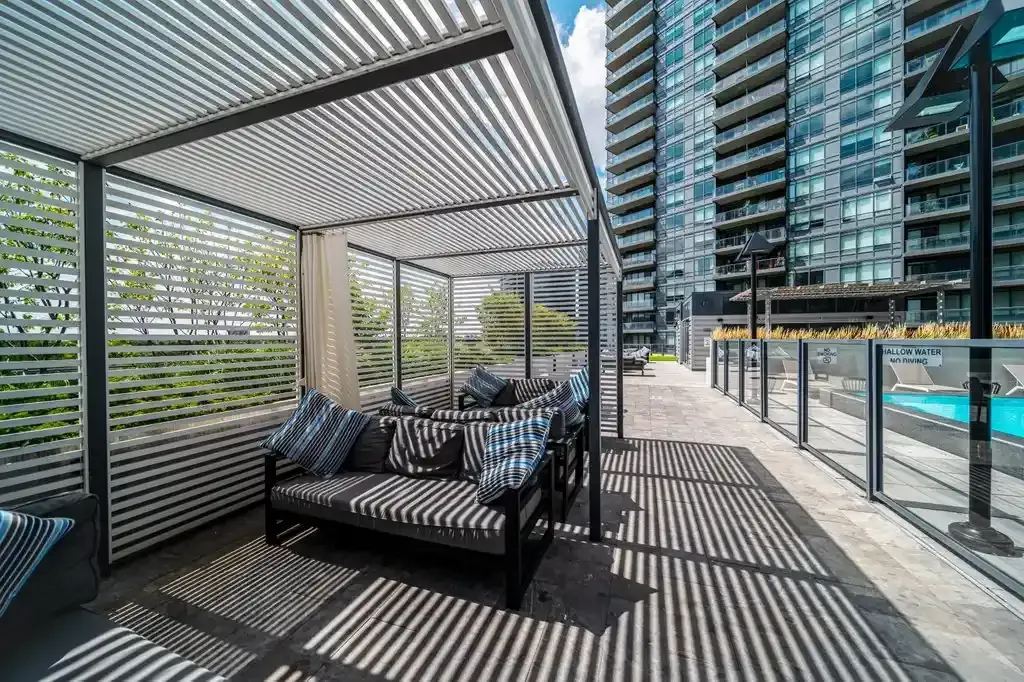 Shaded rooftop lounge area with comfortable seating at 10 Park Lawn Rd, Unit 3402.